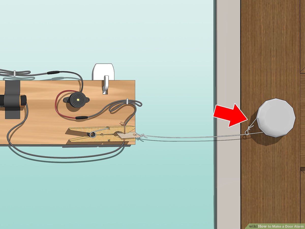 A person connecting a door sensor to a security system